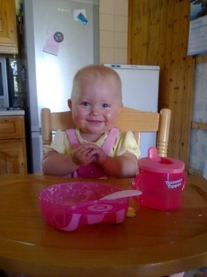 eating dinner in her high chair