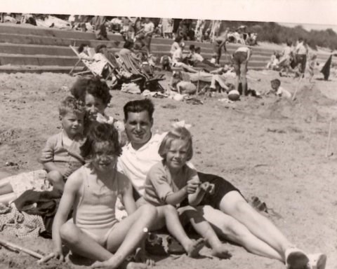 Janet (front left), Christine and John on the beach with their parents (Hilda & George) - 1950