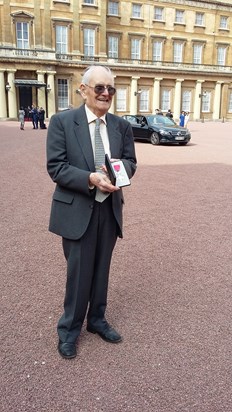 Michael with his MBE, outside Buckingham Palace