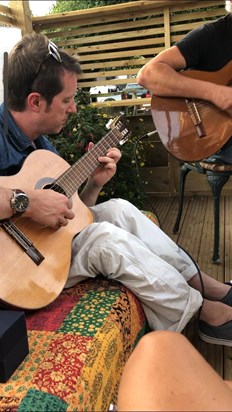 August 2019 Tim serenading is in the garden.