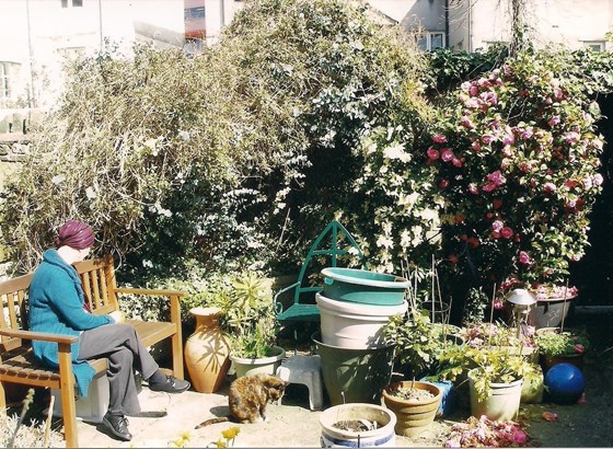 Margaret in her beautiful garden with Bootsy. She loved cats and saved the lives of many xx