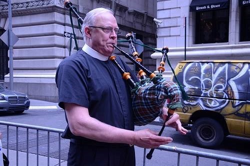 Classic Tim: Marching with bagpipes while wearing the collar