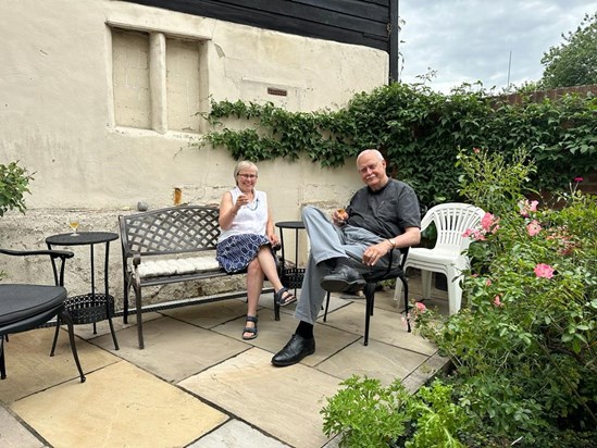 Tim and Caroline in their backyard, enjoying the miniature paradise they found in Waltham Abbey