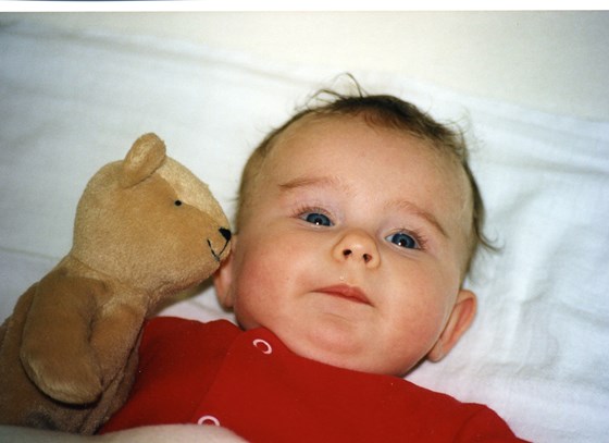 Baby Kara with the imaginatively named 'Teddy', later called Lucie.