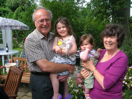 Ken and Janet with their granddaughters at Ken's 80th