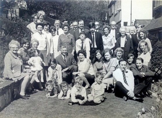 1969 Peter bottom right with pipe. Family gathering.