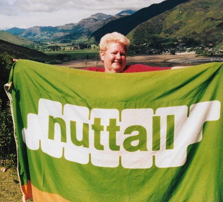 Sue in New Zealand 2004 with Nuttall Flag