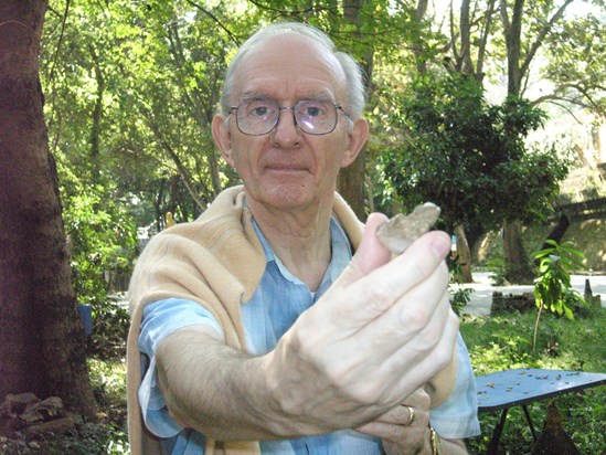 Tom with the tiny, little buddha in his hand, Singapore