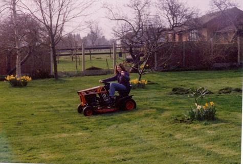 Caz riding the lawn mower