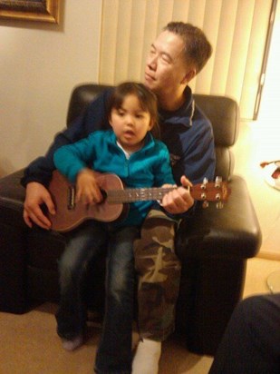Sam and Uncle Joel practicing the uke