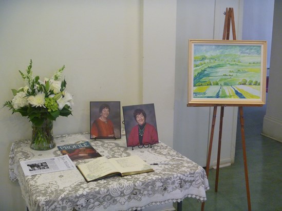 the tribute table with signing book at the reception after the service