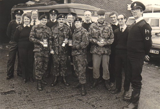 Sorry to read Mick has passed away. My thoughts are with the family. Here is a photo of the Paras at Northfleet Ambulance Station and Mick can be seen at the back in his uniform shirt while the rest of us dressed up for the cold.