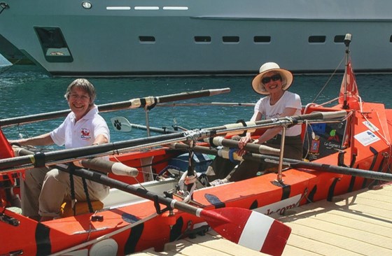 In a boat, having just crossed the Atlantic