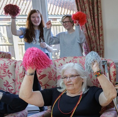 Kasey and another YOPEY Befriender take part in an activity at a care home