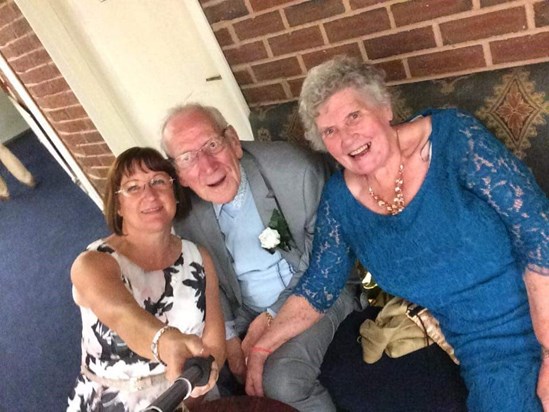 Uncle Charles enjoying a selfie with my mother inlaw at my wedding party
