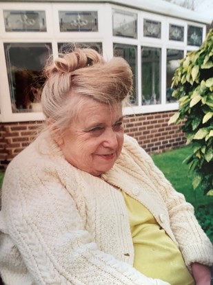 My mother sitting in the garden at home wearing another of her beautiful creations: an Aran cardigan