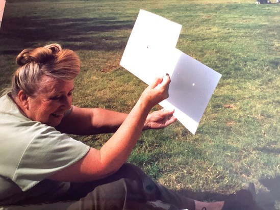 Mummy sitting on Hampstead Heath having fun during the total solar eclipse in August 1999.