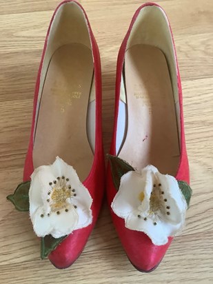 My mother made me a ball gown for my College ball but she surprised me when she also produced these shoes. She dyed them red and made the Christmas roses and leaves on the front of them.