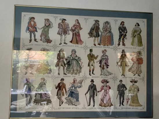 It is difficult to take photographs of this which would do it justice. Mummy made this cross-stitch picture of a history of costume that she decorated further with beads. She translated the text to English and embroidered them.