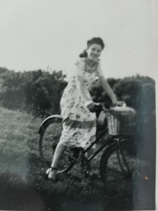 Mother on a bike when she was young circa 1940's