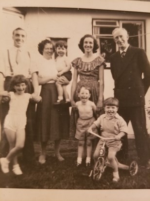 Family snap Uncle Bill, Aunt Maureen, Mum, Grandad Cuz Christine, baby John, Jim, Tony (me) 1955 Old Woking