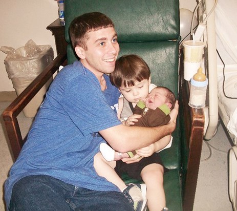 2010...A brand new Parker held by his Daddy and big brother.