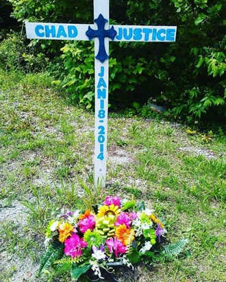 Flowers beside the road where he lost his life