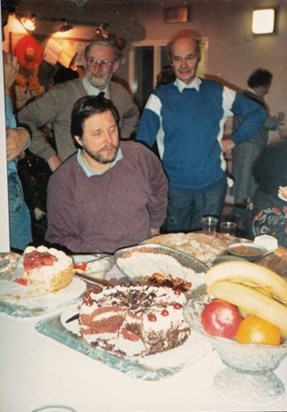 John slavering over a large number of puddings (but don't know where?)