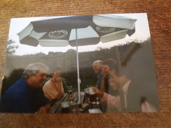 Ian enjoying drinks in a pub garden with his friends David and Lee and my parents 