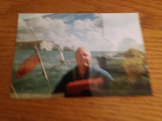 Ian on his boat with the needles in the background 