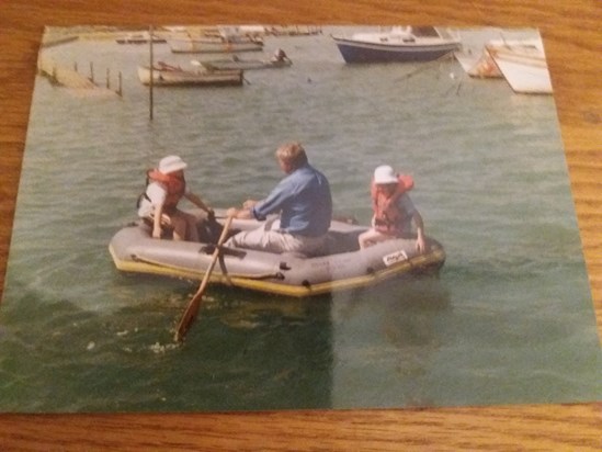 Ian rowing his dinghy with Alex and i 