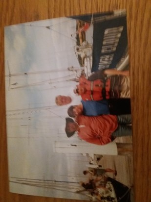 Ian with my parents and i next to his boat 