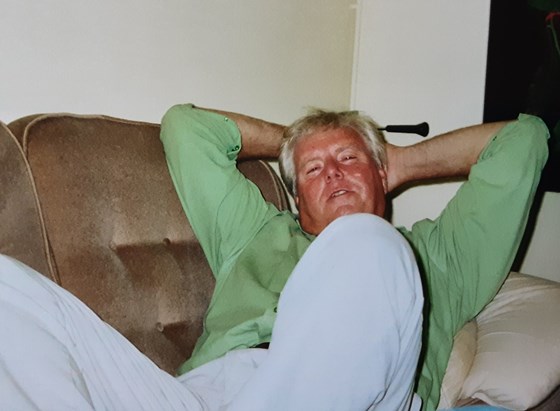 Ian, relaxing at home, after an exhausting sailing, flying or socialising day out. Bob is exhausted at the other end of his sofa.