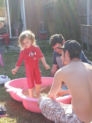 faith tom and Scott in the sand pit shes growing now