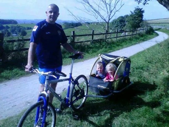 Neil enjoying a bike ride with Amy and Luke