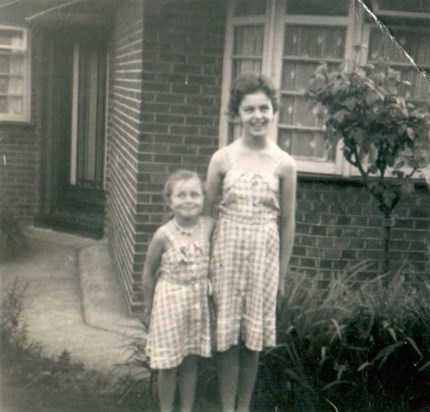Tina and Carol outside childhood home