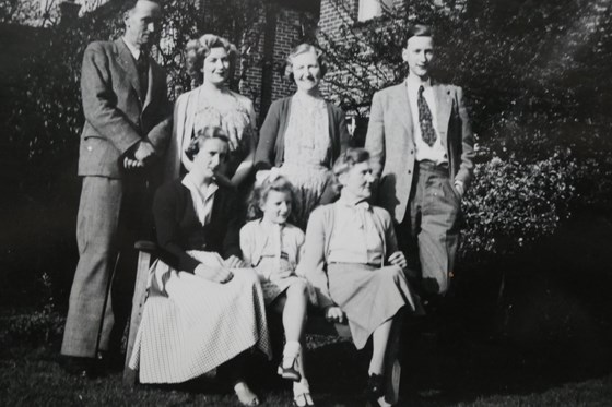 Family photo from L to R back row: Leo, Dora, Elsie, David; front row: Elaine, Berenice, Grandma Hankins 