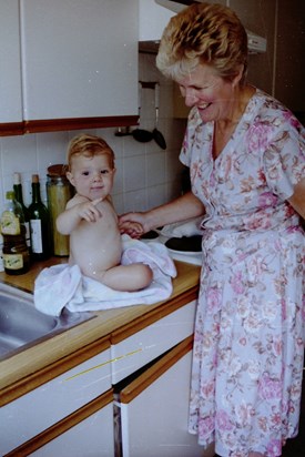 Joan bathing grandaughter, Emma