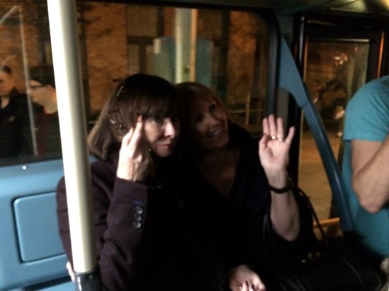 Susan and Angela in the bus luggage rack after a fun night out in London with Mike and Chris .