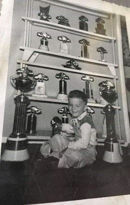 This picture is me wanting to play with just a few of the many has trophies you helped Lee win being his crew chief. I'm so proud of your accomplishments & the ingenuity you set for the racing community!!!