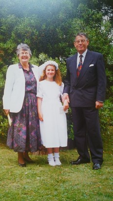 Dad and Mum with Emily at her 1st Holy Communion