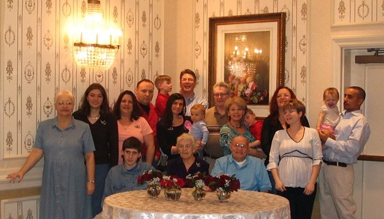 Sandi in the front left & the whole family for Dad's 80th 