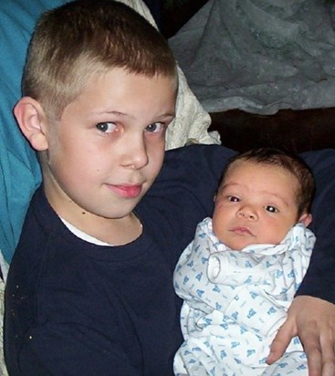 Taylor, 10, with Andrew, 1 month
