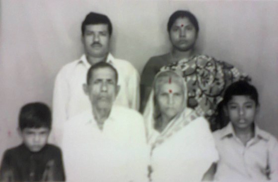 Arup (right) with brother (left), parents (standing) & paternal grandma & grandpa (sitting - middle)