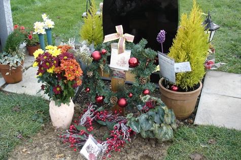 Pretty flowers, wreaths and messages for Paul, with love from family and friends at Christmas