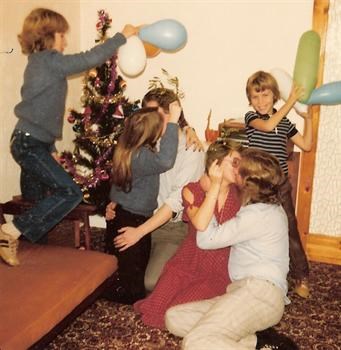 Christmas Day 1979 - Paul's sister Karin having a kissing contest against Uncle Kevin!