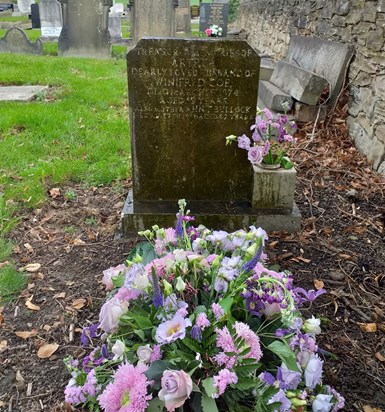 Mums flowers and ashes at the grave of her Mother, Father and Grandmother