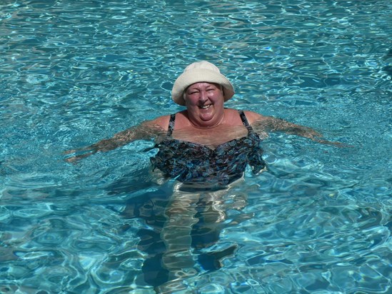 Julie on her last day alive -- enjoying the pool at the Talk of the Town Hotel in Oranjestad, Aruba.