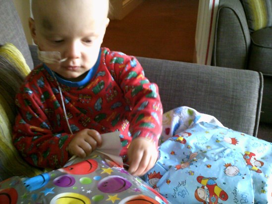 Rhys opening his birthday present on his 2nd birthday
