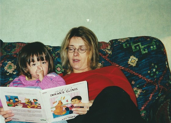 Sharing a story with Neil and Rachel's daughter Izzy in Dolphinholme, Lancashire 2001